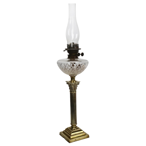 128 - A brass Corinthian column oil lamp with cut-glass font, overall height 80cm