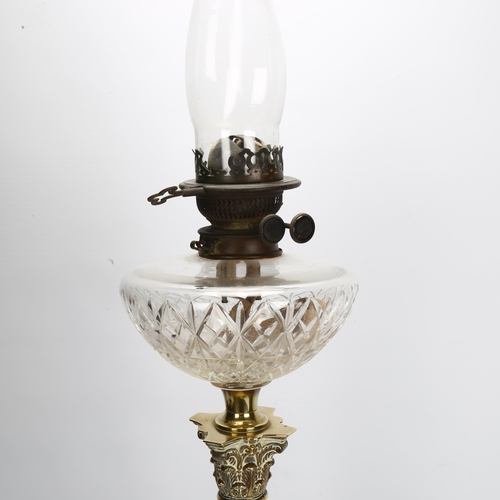 128 - A brass Corinthian column oil lamp with cut-glass font, overall height 80cm