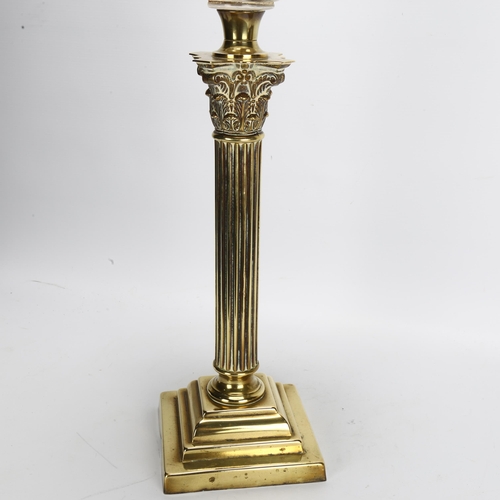 128 - A brass Corinthian column oil lamp with cut-glass font, overall height 80cm