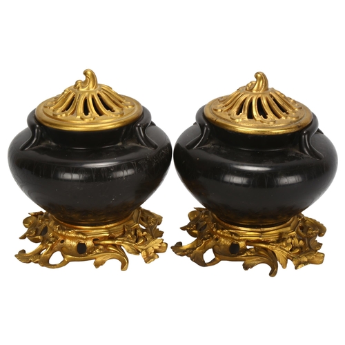 129 - A pair of Napoleon III ormolu-mounted granite vases, with later ormolu mounts and lids, possibly Per... 