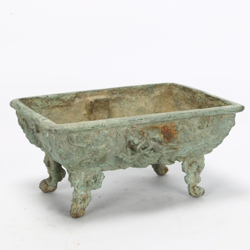 33 - A Chinese verdigris bronze Archaic style 'Dragon' censer, with relief decoration and character marks... 