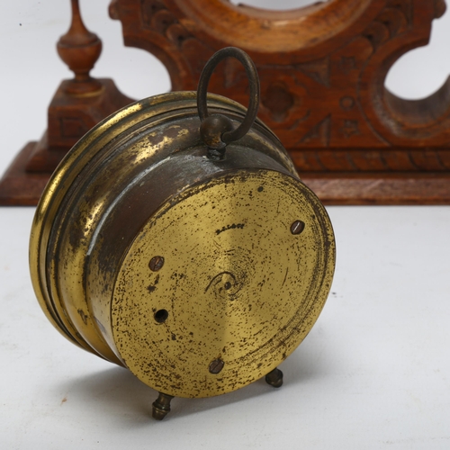 38 - A brass-cased aneroid barometer, maker's mark SJL & Co, on fitted Gothic oak base, width 22cm