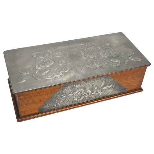 44 - An Art Nouveau pewter-mounted oak box, with relief embossed floral decoration and removable insert, ... 