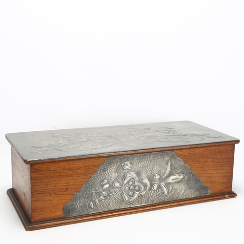 44 - An Art Nouveau pewter-mounted oak box, with relief embossed floral decoration and removable insert, ... 