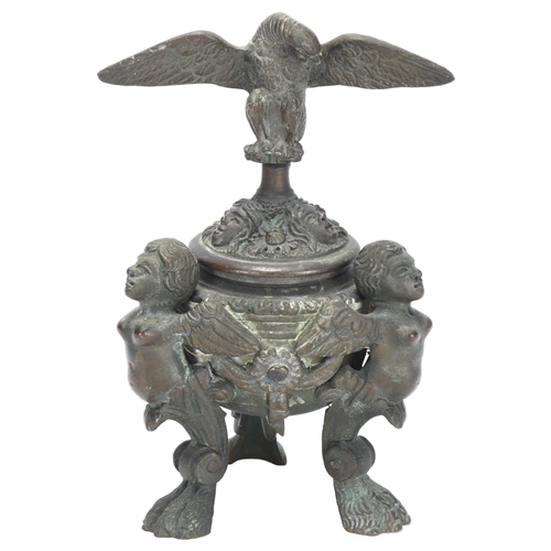 50 - A Napoleon III style patinated bronze inkwell, of Baroque design, with winged monopodia lion paw sup... 