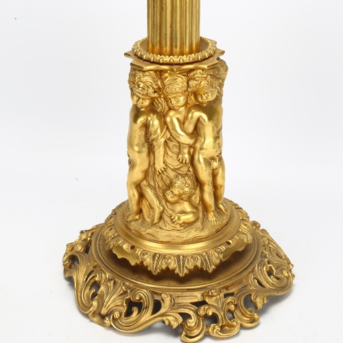 65 - A large ormolu Corinthian column table lamp, with relief putti support and foliate base, height excl... 