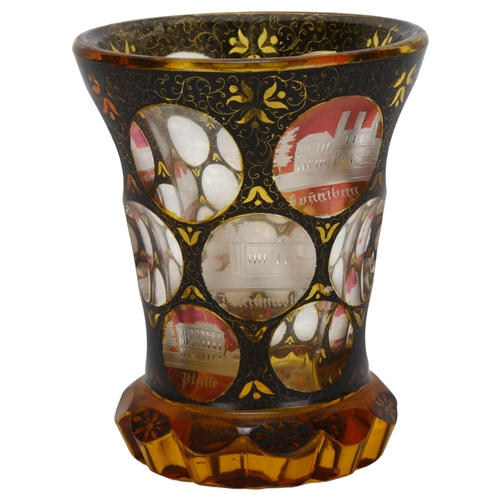 72 - A 19th century Bohemian amber flashed glass spa beaker, with engraved points of interest apertures, ... 