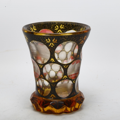 72 - A 19th century Bohemian amber flashed glass spa beaker, with engraved points of interest apertures, ... 