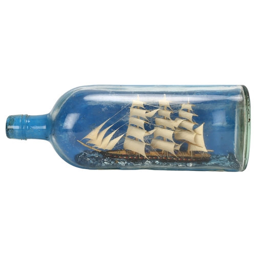 76 - A handmade ship in a bottle, length 30cm