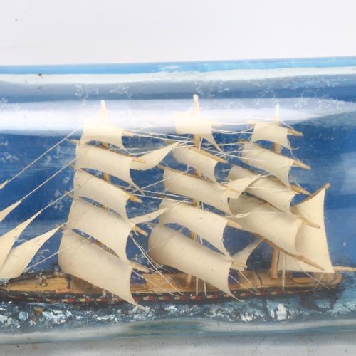 76 - A handmade ship in a bottle, length 30cm