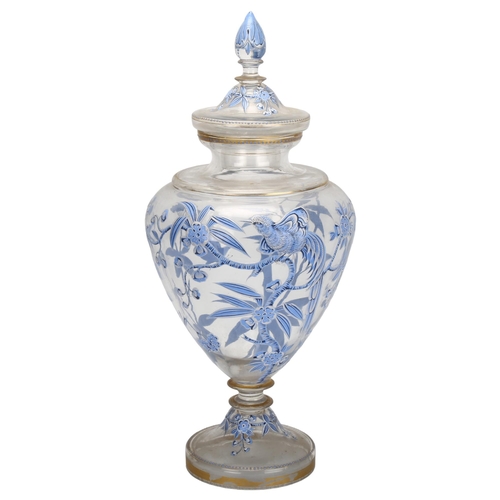 77 - A large 19th century hand painted and enamelled glass sweetmeat jar and cover, with bird and blossom... 