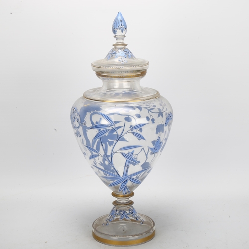 77 - A large 19th century hand painted and enamelled glass sweetmeat jar and cover, with bird and blossom... 