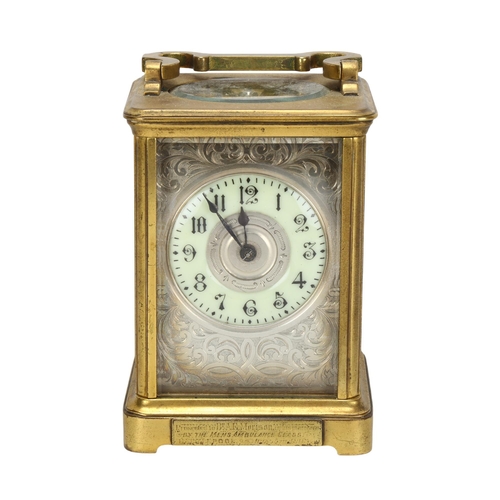 85 - A 19th century brass-cased carriage clock, foliate engraved silvered dial with enamel chapter ring a... 