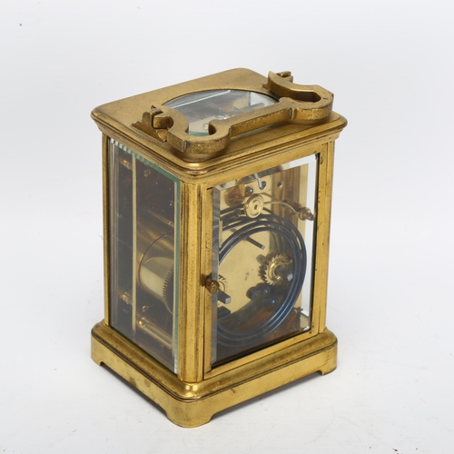 85 - A 19th century brass-cased carriage clock, foliate engraved silvered dial with enamel chapter ring a... 