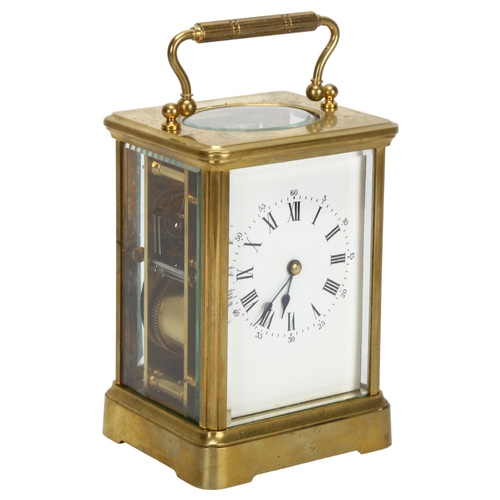 86 - A 19th century brass-cased carriage clock, white enamel dial with Roman numeral hour markers and mov... 