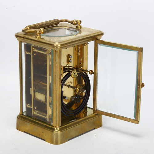 86 - A 19th century brass-cased carriage clock, white enamel dial with Roman numeral hour markers and mov... 