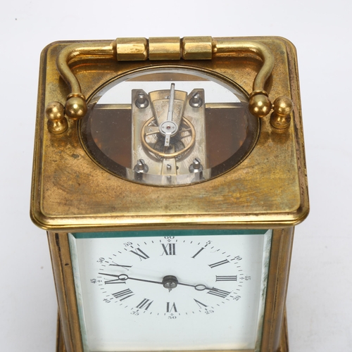 88 - A brass-cased carriage clock, white enamel dial with Roman numeral hour makers, back plate no. 613, ... 