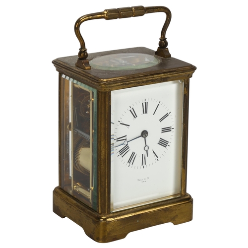 90 - A 19th century French brass-cased carriage clock, by Hall & Co of Paris, white enamel dial with Roma... 