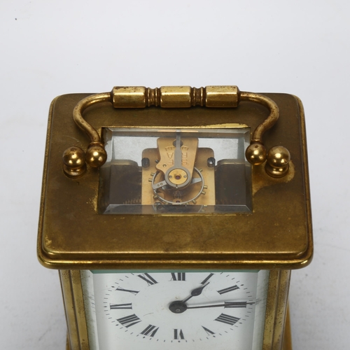 91 - A French brass-cased carriage clock, white enamel dial with Roman numeral hour markers, case height ... 