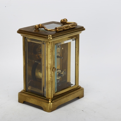 91 - A French brass-cased carriage clock, white enamel dial with Roman numeral hour markers, case height ... 