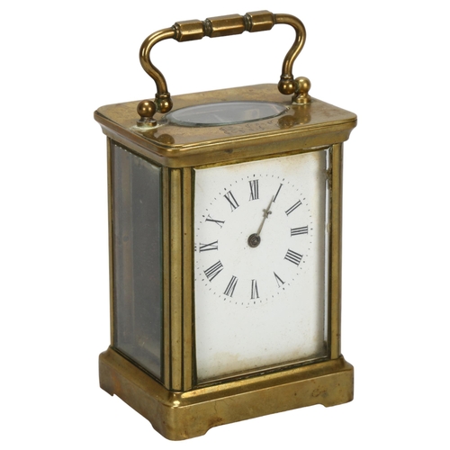 92 - A 19th century brass-cased carriage clock, white enamel dial with Roman numeral hour markers, case h... 