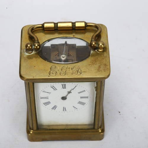 92 - A 19th century brass-cased carriage clock, white enamel dial with Roman numeral hour markers, case h... 