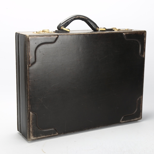 95 - GUCCI - a Vintage black pig-skin briefcase, with combination lock, 45cm x 33cm