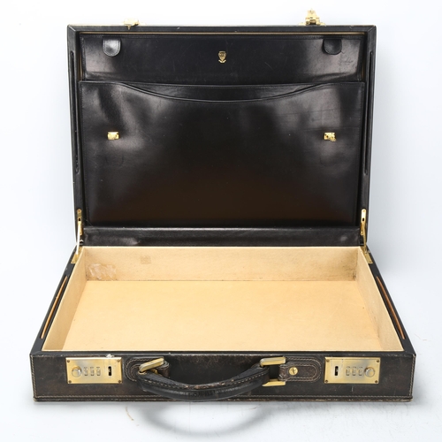 95 - GUCCI - a Vintage black pig-skin briefcase, with combination lock, 45cm x 33cm