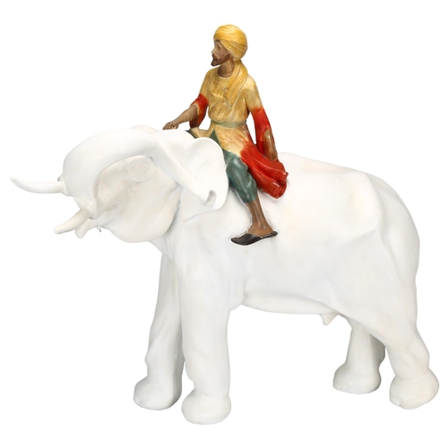 132 - A large 1930s ceramic elephant and Mahout, height 60cm