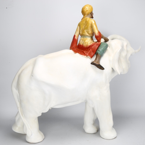 132 - A large 1930s ceramic elephant and Mahout, height 60cm