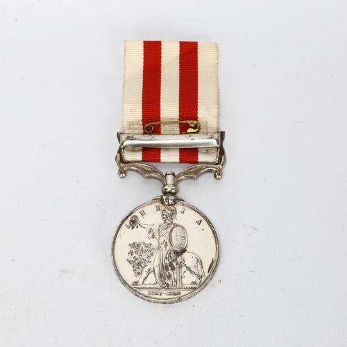 139 - An 1857/58 India Mutiny medal with Lucknow bar, to 9337 Gunner John Murnane, Bengal Artillery