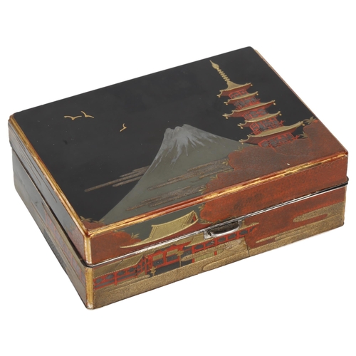 145 - An early 20th century Japanese lacquer trinket box, with silver Mount Fuji design, stamped silver, 1... 