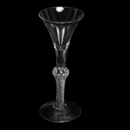 148 - An 18th century baluster air twist wine / cordial glass, height 18cm