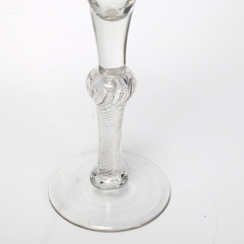 148 - An 18th century baluster air twist wine / cordial glass, height 18cm