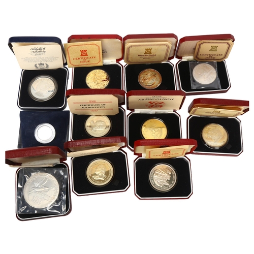 170 - 11 silver and silver-gilt commemorative coins, all cased