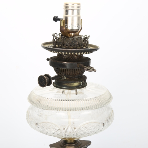 173 - An early 20th century silver Corinthian column oil lamp with cut-glass font, converted to electric, ... 