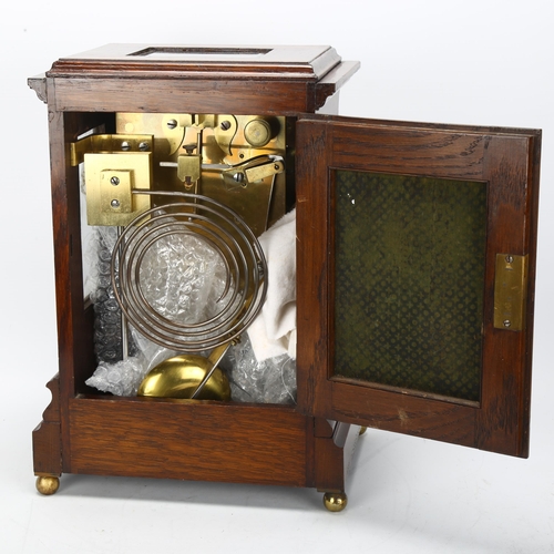 174 - An early 20th century oak-cased 8-day table clock, by Clifford Lupton of London, with bevelled glass... 