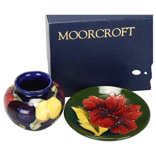 176 - A small Moorcroft Wisteria pattern vase, and a Moorcroft Hibiscus pattern dish, diameter of dish 11.... 