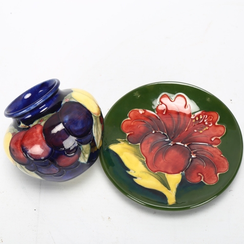 176 - A small Moorcroft Wisteria pattern vase, and a Moorcroft Hibiscus pattern dish, diameter of dish 11.... 