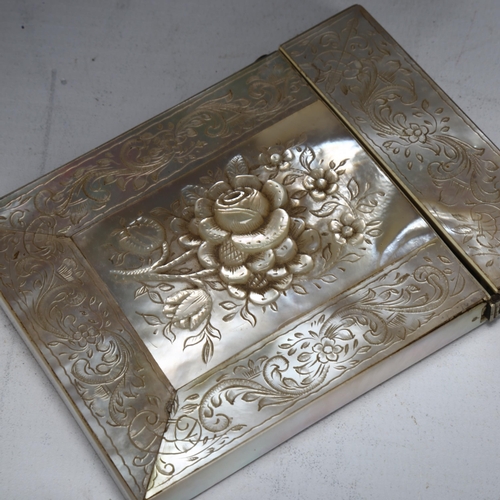 183 - A 19th century mother-of-pearl carved and engraved card case, with rose in high relief to front pane... 