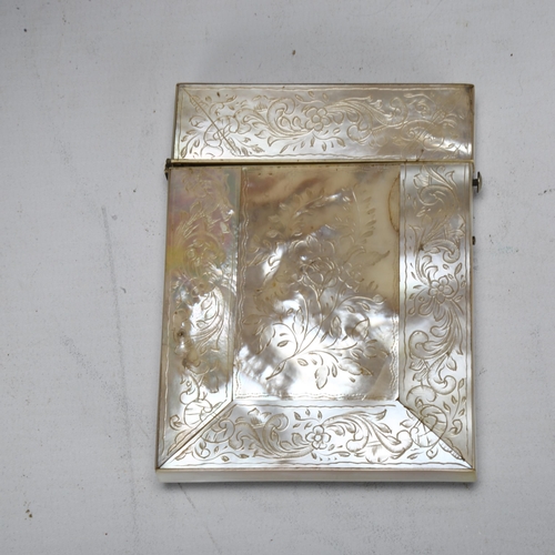 183 - A 19th century mother-of-pearl carved and engraved card case, with rose in high relief to front pane... 