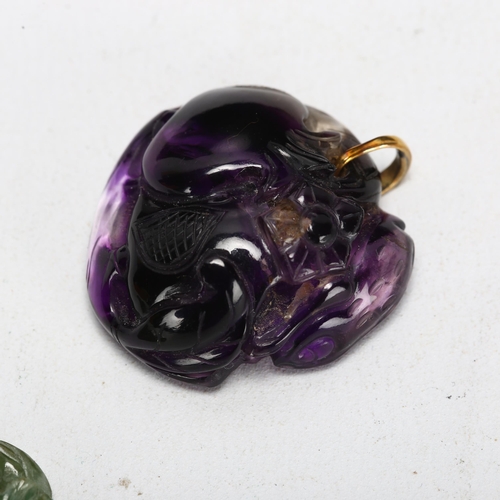 184 - A Chinese fluorite 'Pomegranate' pendant, with yellow metal clasp, and a green jade 'Gourd' panel, l... 