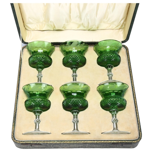 193 - A cased set of 6 green cut crystal thistle wine glasses, with etched thistle decoration