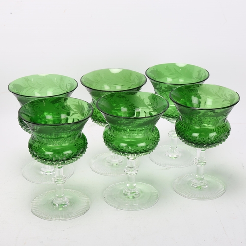 193 - A cased set of 6 green cut crystal thistle wine glasses, with etched thistle decoration