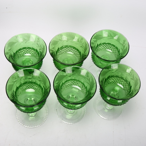 193 - A cased set of 6 green cut crystal thistle wine glasses, with etched thistle decoration