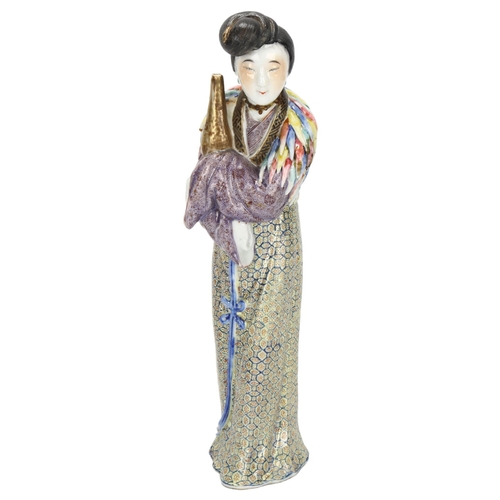 197 - A 19th century Chinese porcelain figure with fine enamel decoration, height 25cm