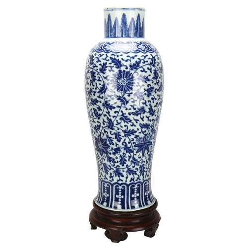 198 - A large Chinese blue and white baluster vase with floral decoration, on wooden stand, height of vase... 