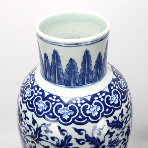 198 - A large Chinese blue and white baluster vase with floral decoration, on wooden stand, height of vase... 