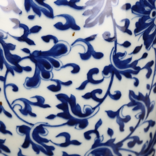 198 - A large Chinese blue and white baluster vase with floral decoration, on wooden stand, height of vase... 