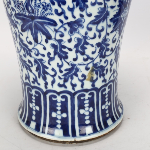 198 - A large Chinese blue and white baluster vase with floral decoration, on wooden stand, height of vase... 